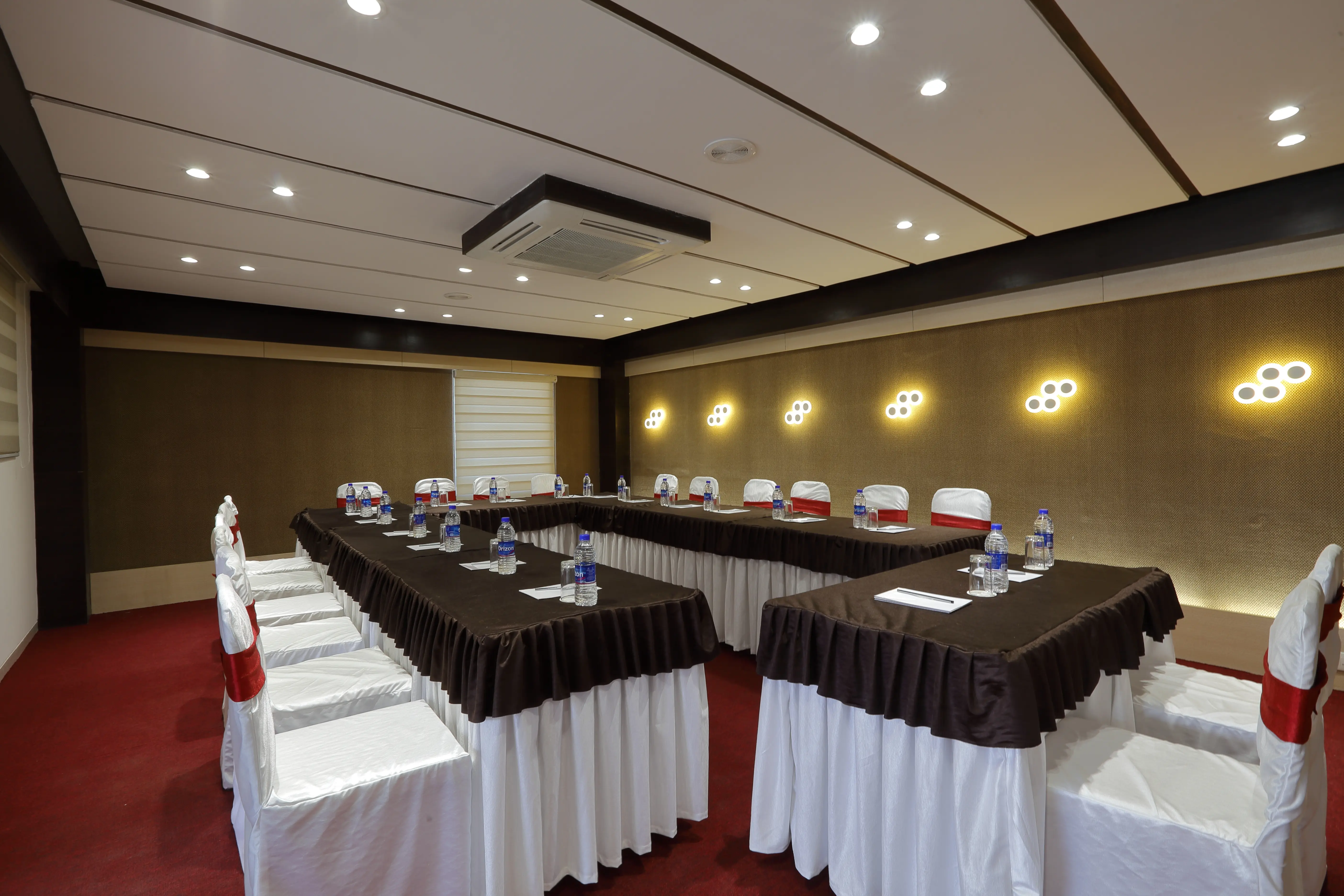 Modern conference hall with presentation screen and chairs